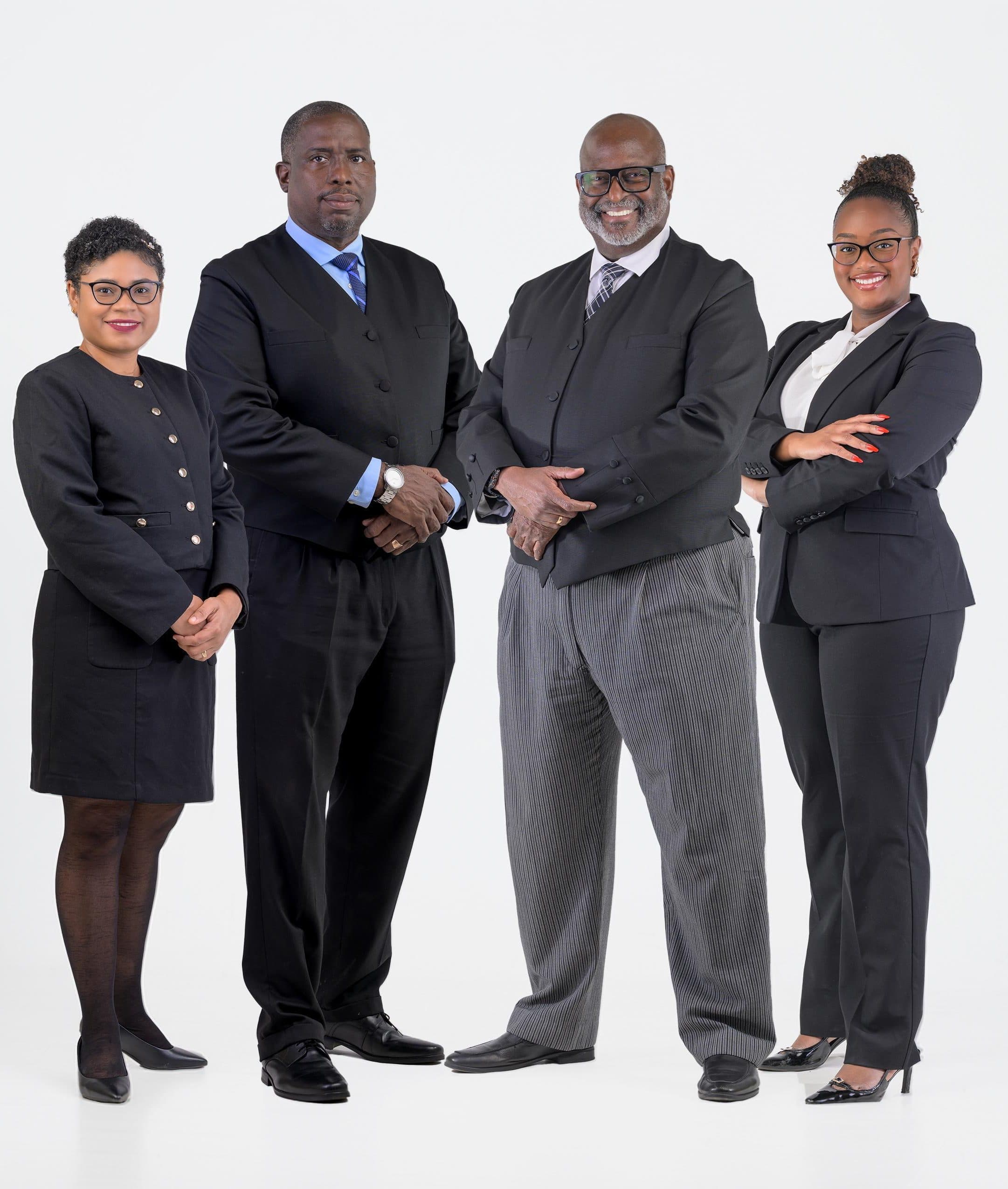 The four attorneys of Fraser & Housty standing together: Shantel R. Scott-Lall, Teni E. Housty, Stephen G.N. Fraser, S.C., and Sydney A. Fraser